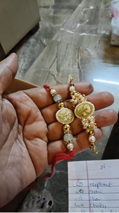 Picture of 🌸 "Pearl Petals Rakhi Elegance" 🤍✨